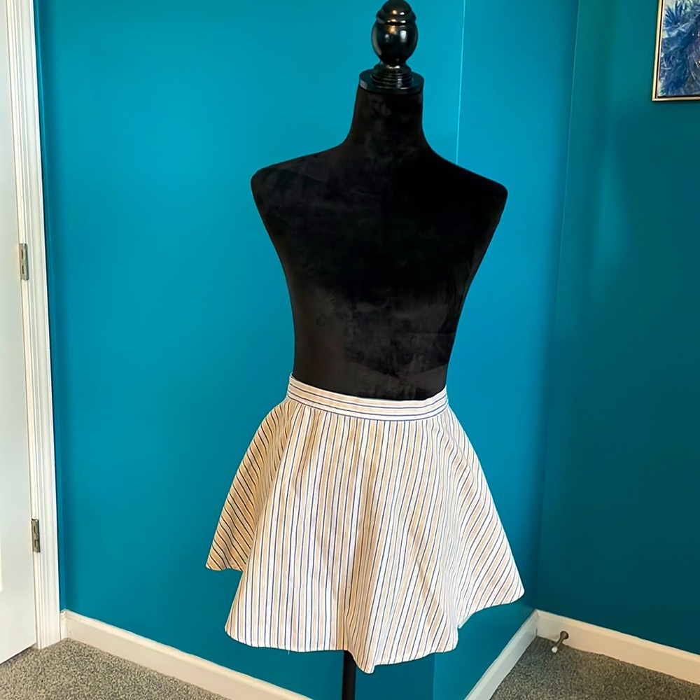 Vintage hostess apron with multi stripe print.